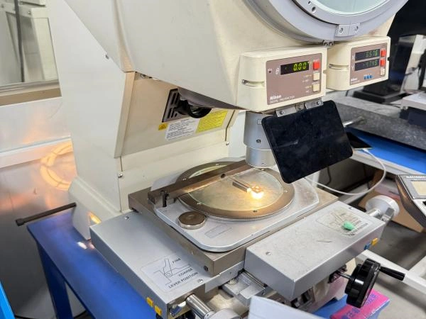 Optical profile inspection of a precision part using a profile projector